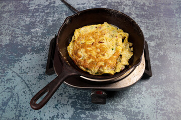 frying pan with omelet in pan