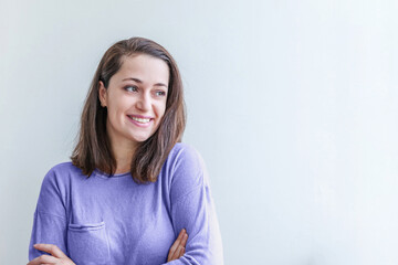 Obraz premium Young happy positive smiling woman, clothes blouse shirt colored in trendy color of year 2022 Very Peri, white background isolated. Inspired by using color 17-3938, Color of the year concept.