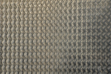 silver shiny aluminum expanded metal sheet. non-slip industrial design lining fences, gates, walls. texture with different guide line