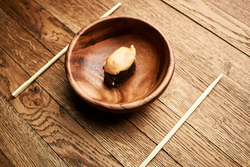 sushi on wooden plates chopsticks Japanese cuisine Asia Fish
