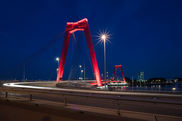 Fototapeta na wymiar red illuminated Willems Bridge in Rotterdam