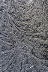 Frosty patterns on a gray background.