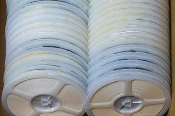 Microelectronics Concepts. Two Batches of SMD or Surface Mount Components On Tape and Reel Holders in One Box Together.