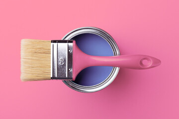 Can of very trendy 2022 color peri with brush on pink background.