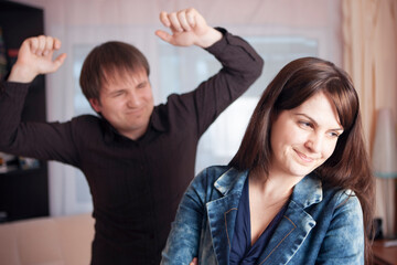 Family Issues. Caucasian Couple Quarrel Indoors With Expressive Emotions