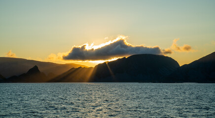 Fototapeta premium Setting sun over Vaeroy, Lofoten islands, Norway 