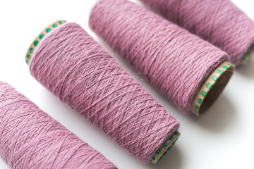 Bobbins with yarn on a white background. Colored yarn. 