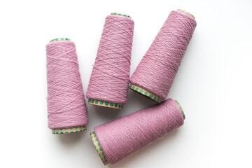 Bobbins with yarn on a white background. Colored yarn. 