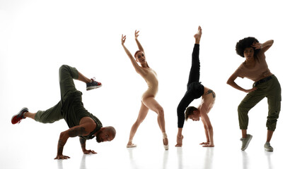 Couple dancing hip hop dance against ballet couple