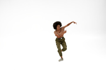Beautiful black brunette girl dancing hip hop