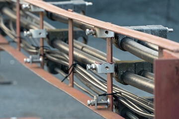 A lot of thick black wires come out of the cell tower. Optical fiber transmits high-density data....