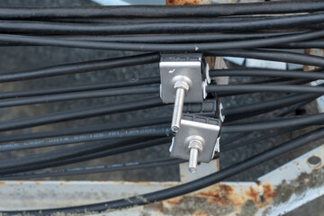A lot of thick black wires come out of the cell tower. Optical fiber transmits high-density data....