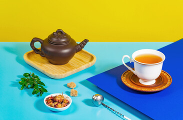 Tea with dessert on a bright colored background