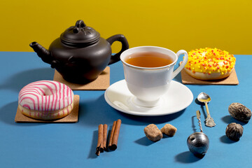 Tea with dessert on a bright colored background 