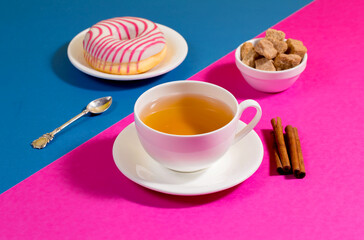 Tea with dessert on a bright colored background 