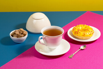 Tea with dessert on a bright colored background