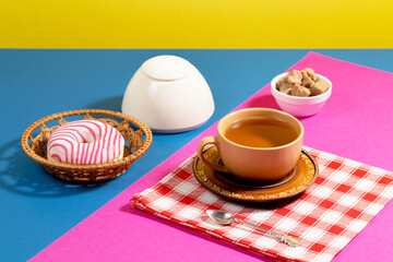 Tea with dessert on a bright colored background 