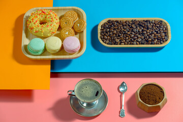 Coffee with dessert on a bright colored background 