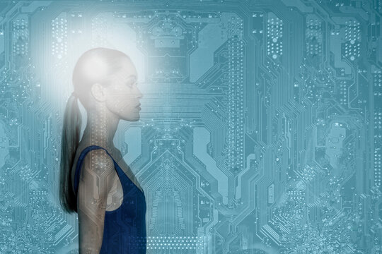 Young woman looking away over blue circuit board