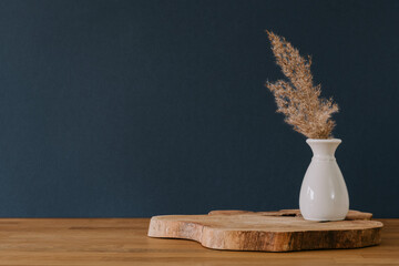 Decoration in vase on navy background with copy space