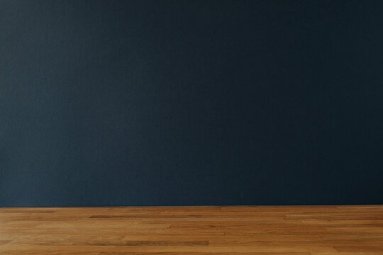 Dark blue background for copy space and wooden table