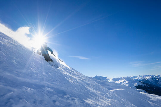 Sun Shining Over Man Skiing InArlbergmassif