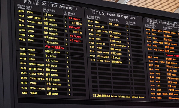 Shanghai, China - February 22, 2019: Schedule board displaying flight information in the departure hall of Shanghai Pudong International Airport.