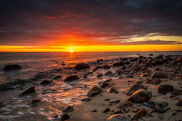 Fototapeta na wymiar Amazing landscape of the beach at Orlowo cliff at sunrise, Gdynia. Poland