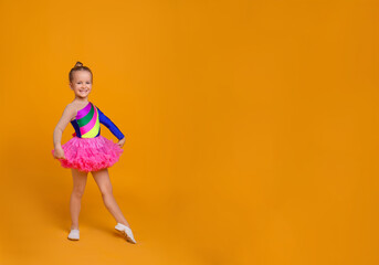 Fototapeta na wymiar Cute little girl in costume dancing on orange background. Space for text