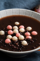 Red and white tangyuan with red bean soup.