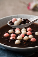 Red and white tangyuan with red bean soup.