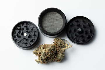 Metallic black grinder with buds of marijuana, weed cannabis, medical marijuana