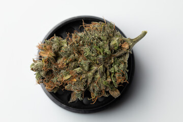 Metallic black grinder with buds of marijuana, weed cannabis, medical marijuana