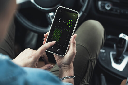 Woman unlocking data lock on smart phone in car