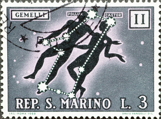 San Marino - circa 1970: A post stamp printed in San Marino showing the zodiac sign Gemini - The...