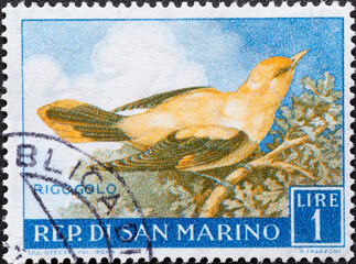 San Marino - circa 1960: A post stamp printed in San Marino showing a bird: Golden Oriole (Oriolus...