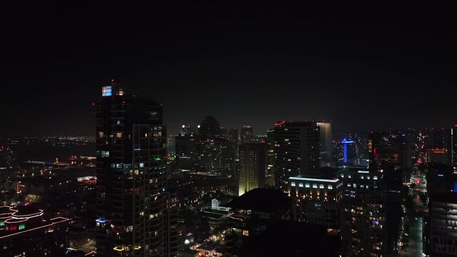wide aerial nightscape of San Diego downtown. Lit Skyline of financial and residential district