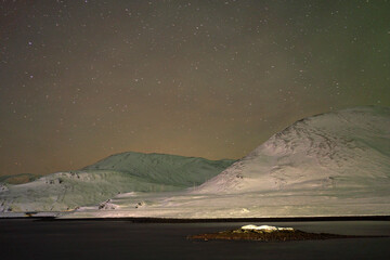 nights picture of the sky full of stars with mountain and ocean