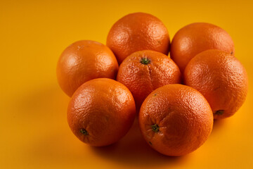 Oranges on a yellow background