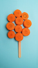Orange slices of carrots on a blue background.