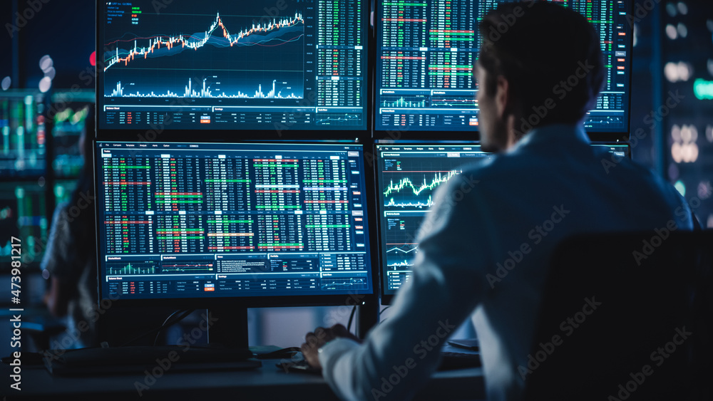 Poster financial analysts and day traders working on a computers with multi-monitor workstations with real-