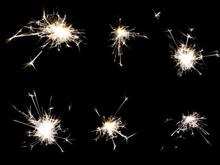 6-pack of birthday Sparklers Isolated on black background. Sparklers sparks from burning...