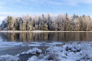 River in a cold winter landscape with snow and frost