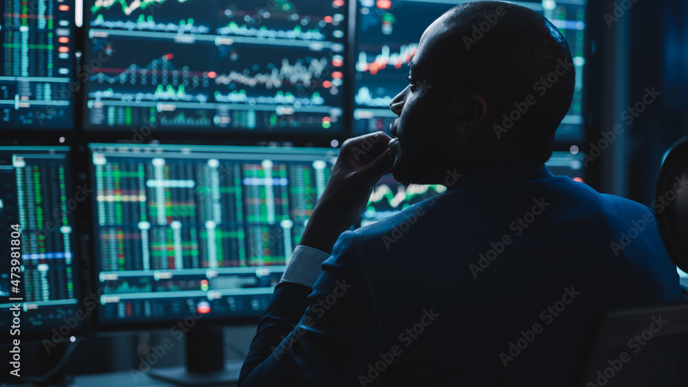 Poster close up portrait of financial analyst working on computer with multi-monitor workstation with real-