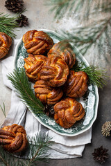 homemade christmas sweet swirling cinnamon buns on a serving platter
