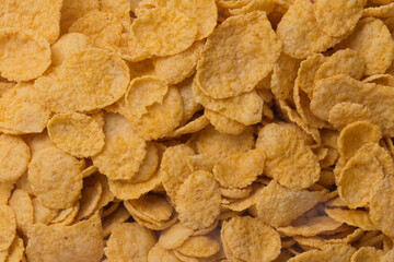 pile of cereal corn flakes background close up filled frame copy space wallpaper shot