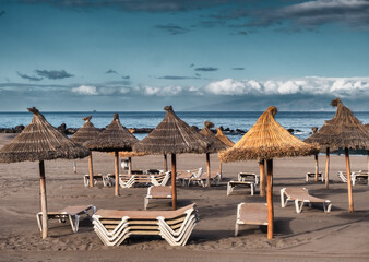 Beach with sunshades Playa Los Americas on Tenerife, Spain