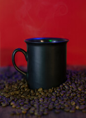 Black cup with hot coffee and coffee beans on bright background