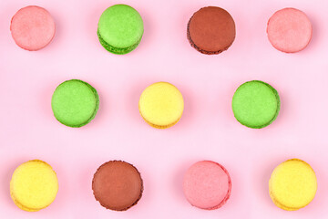 Obraz na płótnie Canvas Bright multicolored cookies on a pink background.