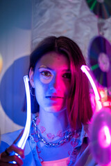 Cinematic night portrait of girl and neon lights. Fashion. Woman in Colorful neon light. girl in disco, makeup dance. Party disco neon nightclub vibes. creative art neon pink blue light.